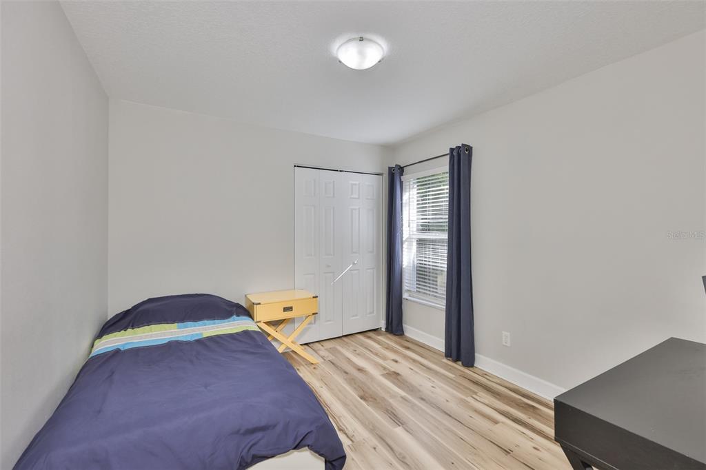 2331 West Chestnut Street Tampa, FL 33607 - Photo 21 of 34 a bedroom with a bed and a window