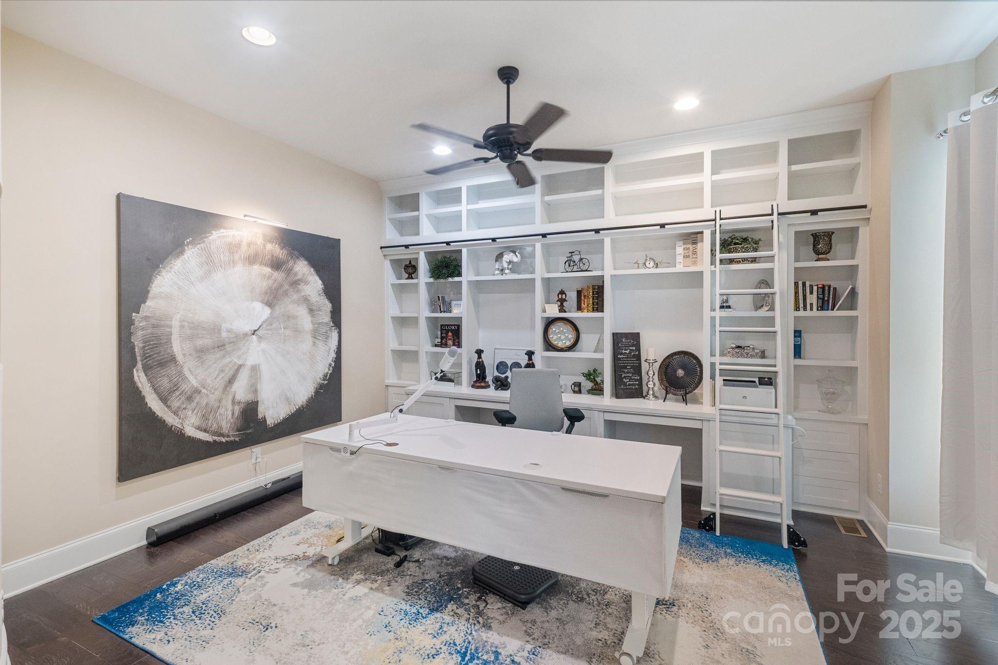2051 Brawley School Road Mooresville, NC 28117 - Photo 12 of 47 a work room with furniture a rug and white walls
