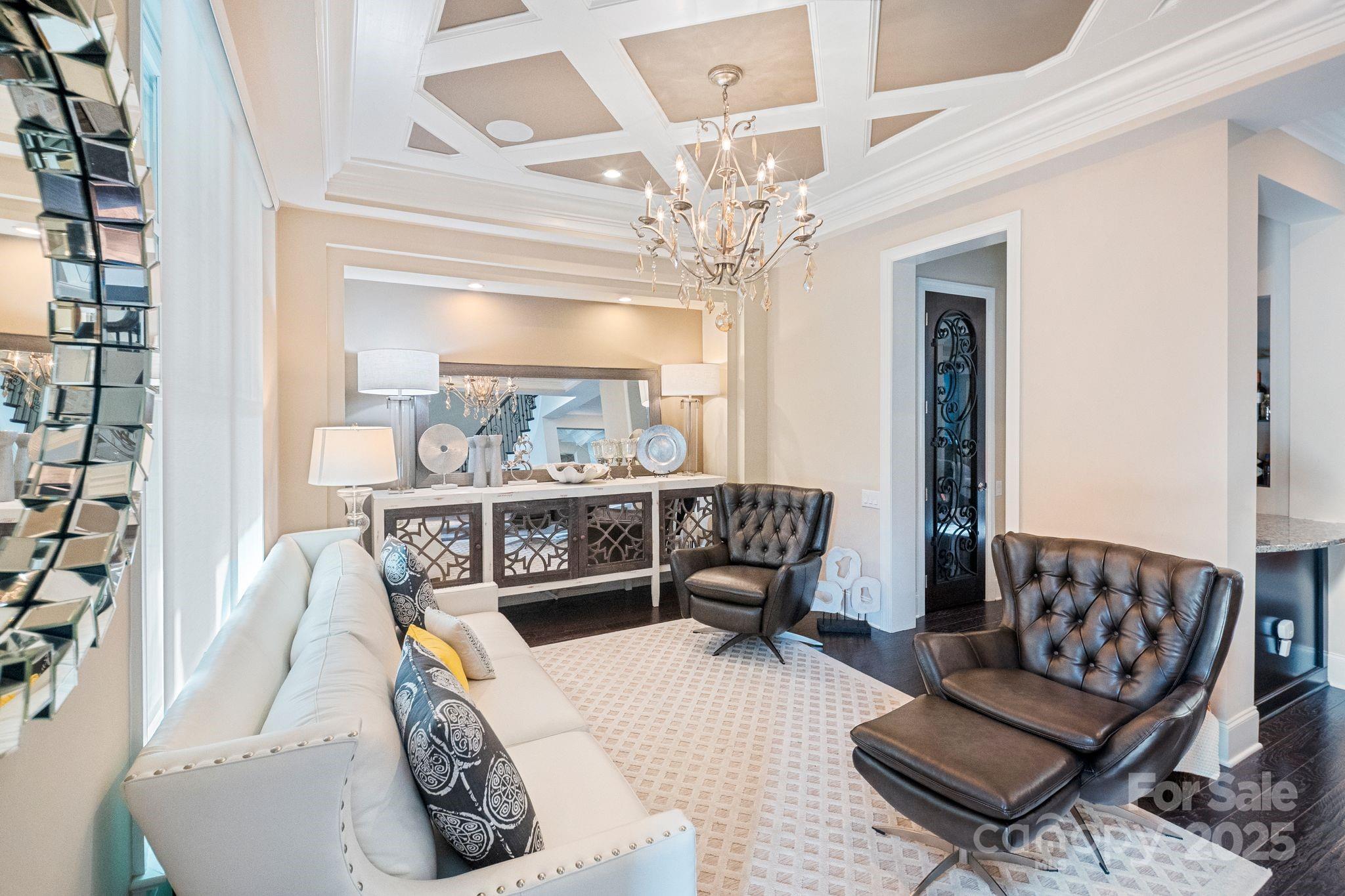 2051 Brawley School Road Mooresville, NC 28117 - Photo 13 of 47 a living room with furniture and a chandelier