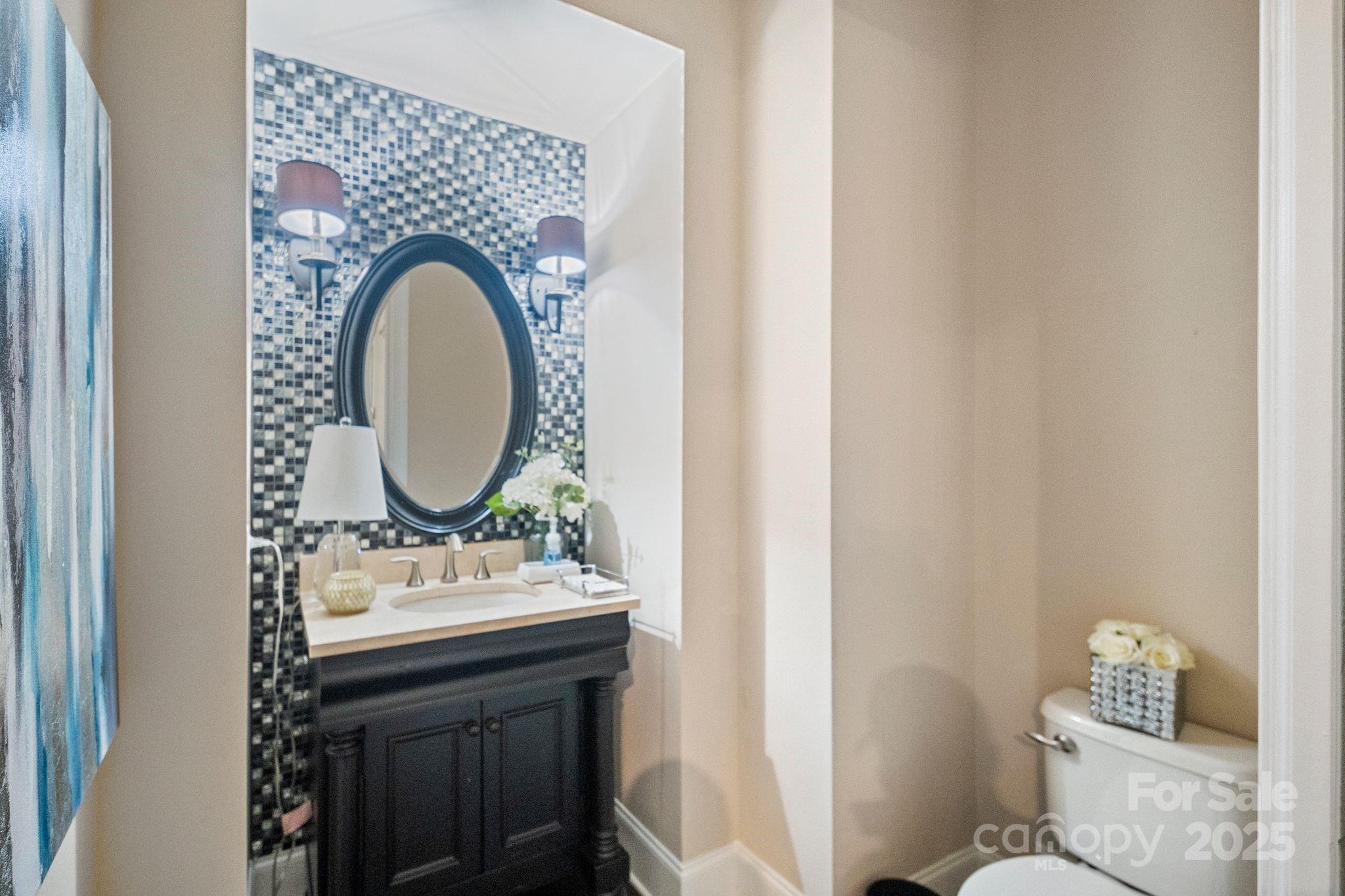 2051 Brawley School Road Mooresville, NC 28117 - Photo 14 of 47 a bathroom with a sink and a mirror