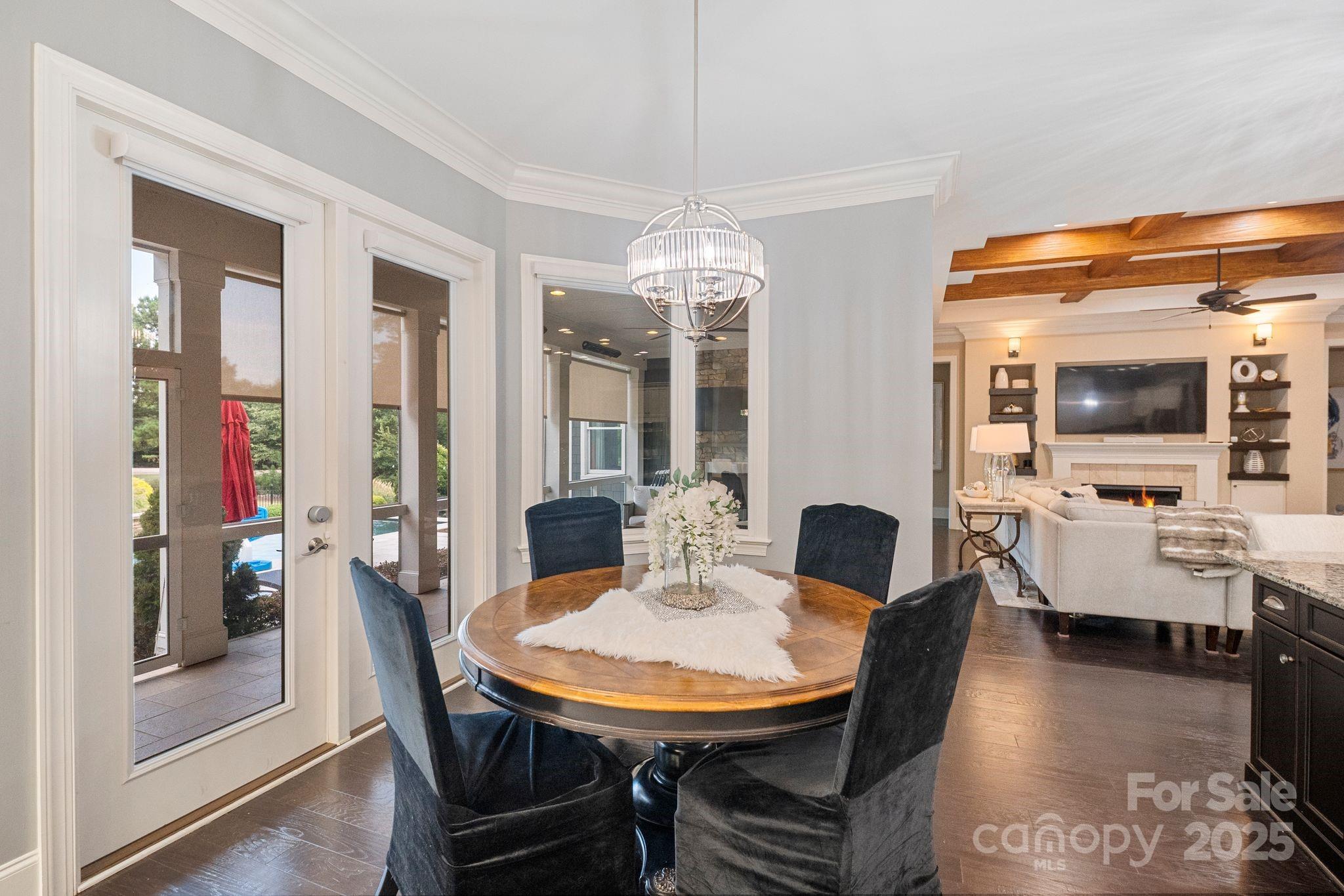 2051 Brawley School Road Mooresville, NC 28117 - Photo 22 of 47 a view of a dining room with furniture and wooden floor