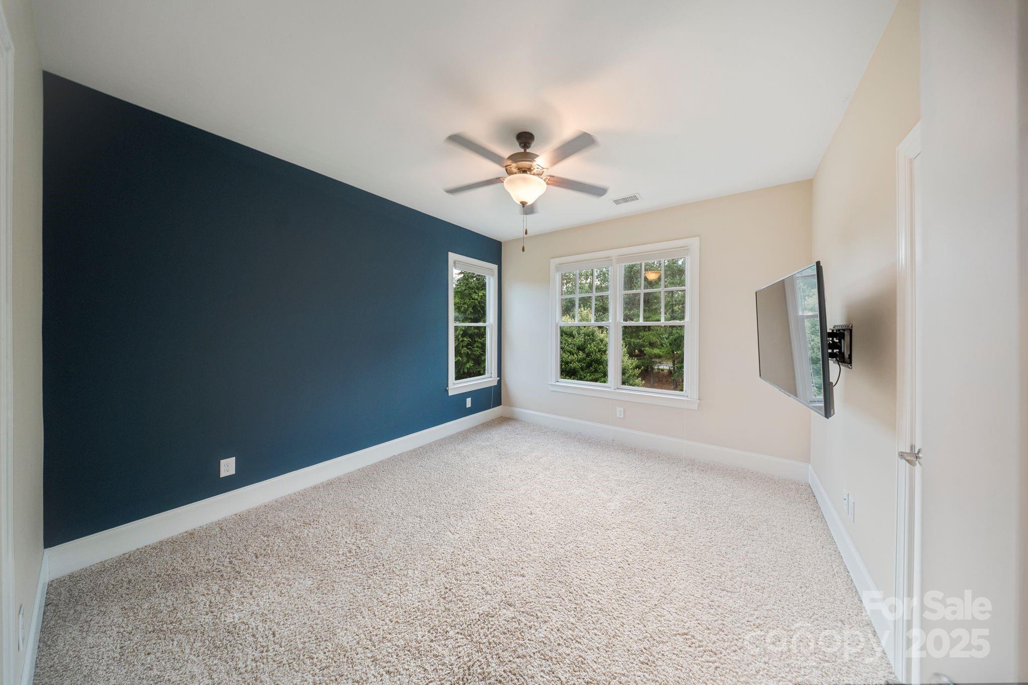 2051 Brawley School Road Mooresville, NC 28117 - Photo 29 of 47 a view of a livingroom with a ceiling fan and window
