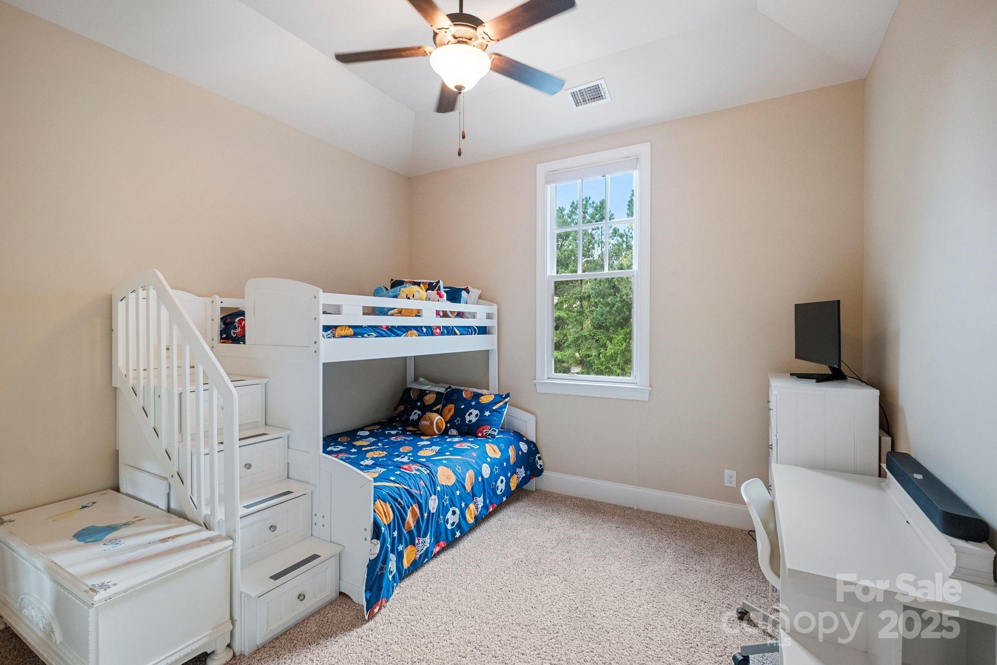 2051 Brawley School Road Mooresville, NC 28117 - Photo 37 of 47 a bedroom with a bed and a window
