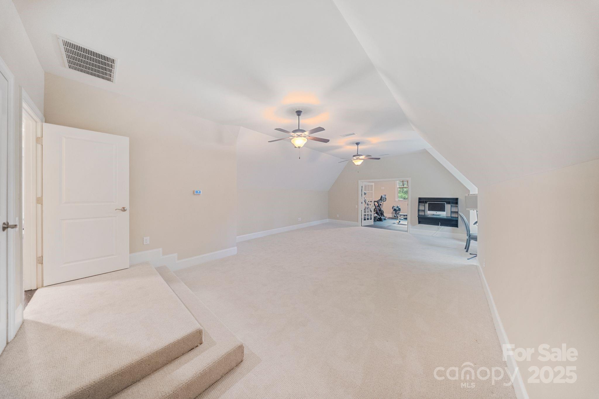 2051 Brawley School Road Mooresville, NC 28117 - Photo 39 of 47 a view of a livingroom and a ceiling fan