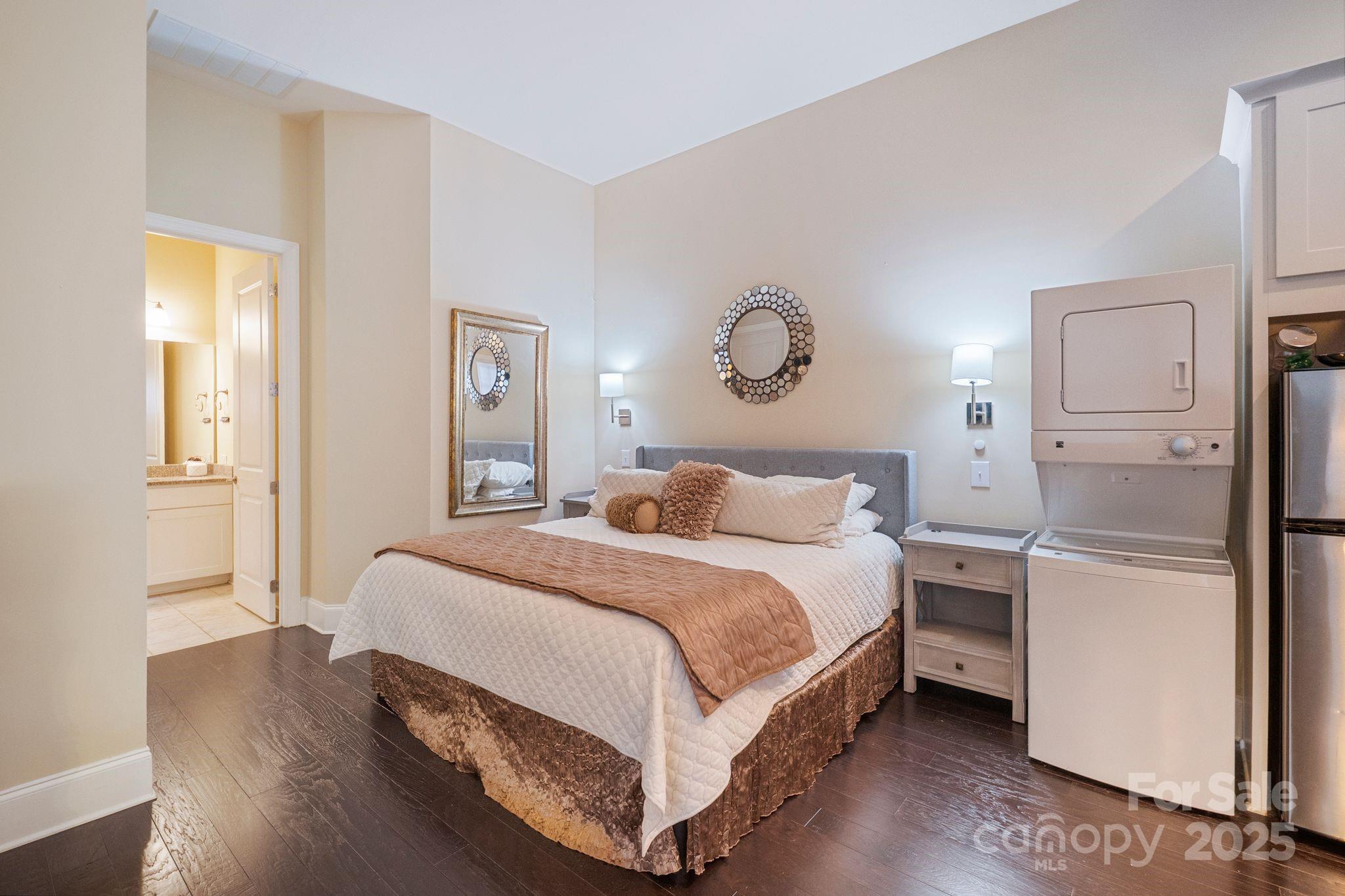 2051 Brawley School Road Mooresville, NC 28117 - Photo 43 of 47 a bedroom with a bed and a lamp