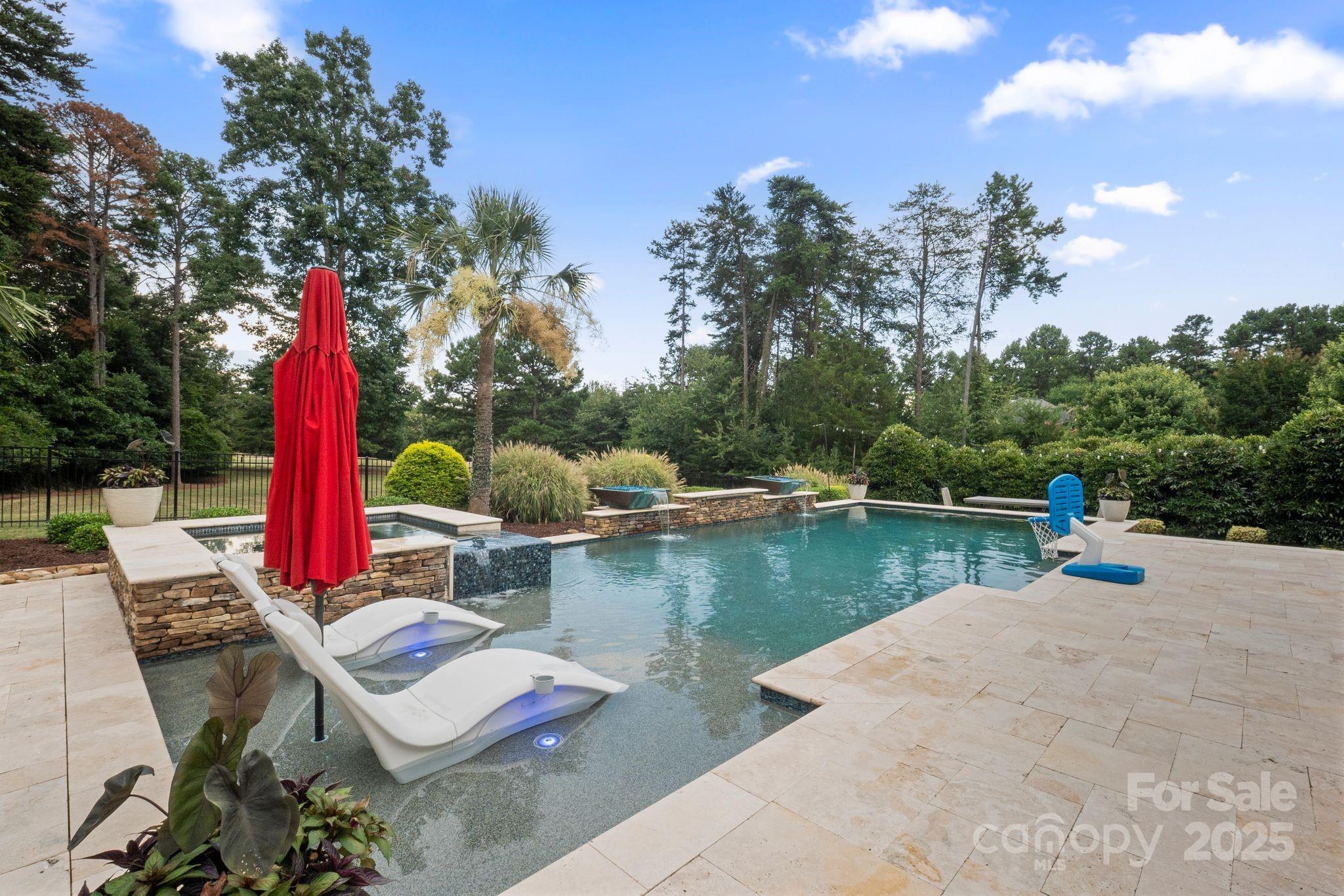 2051 Brawley School Road Mooresville, NC 28117 - Photo 5 of 47 a view of a swimming pool with a patio and a yard