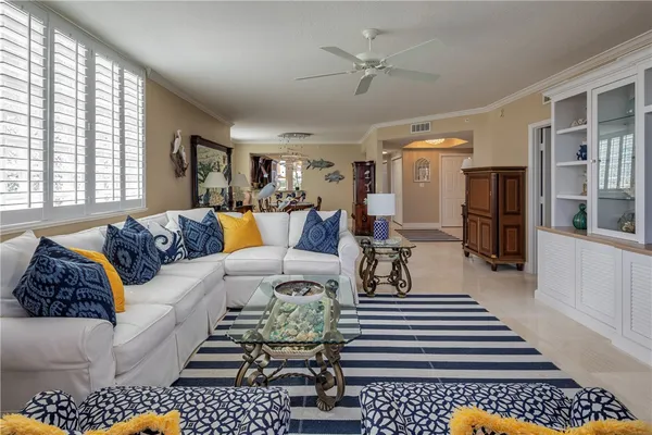 a living room with furniture and a rug