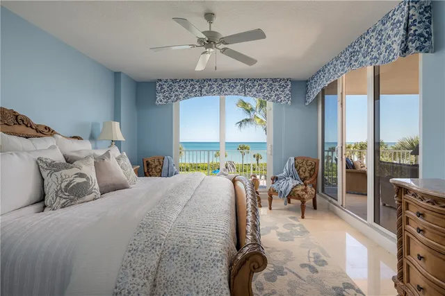 a bed room with a bed and a chandelier