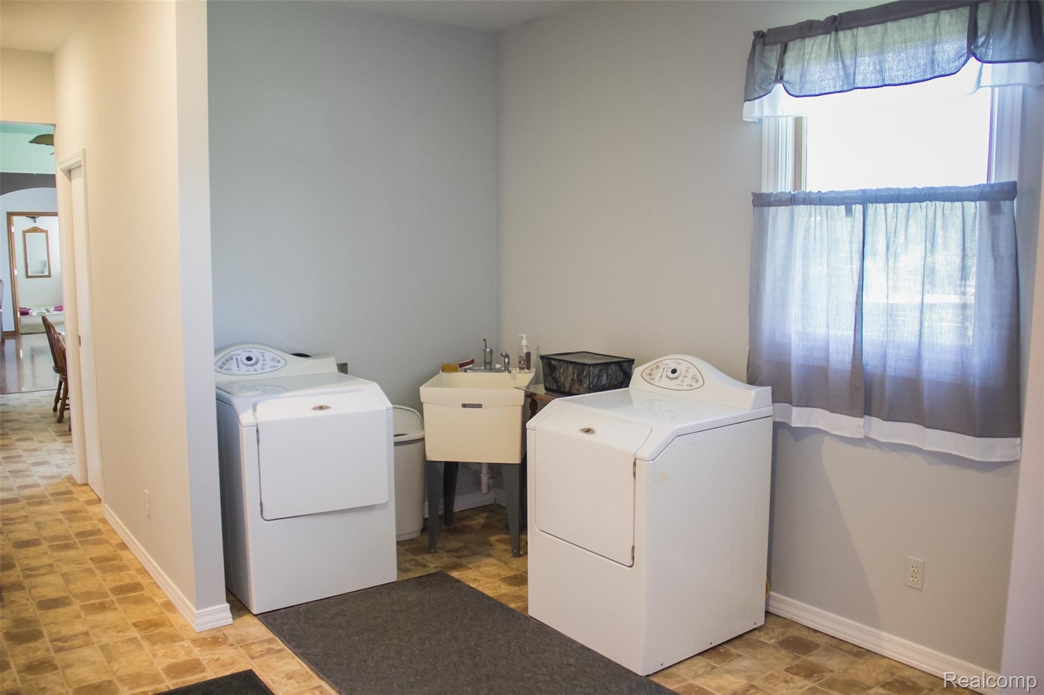 11089 West Mohrle Road Webberville, MI 48892 - Photo 19 of 31 1st Floor Laundry with High Energy Washer & Dryer included