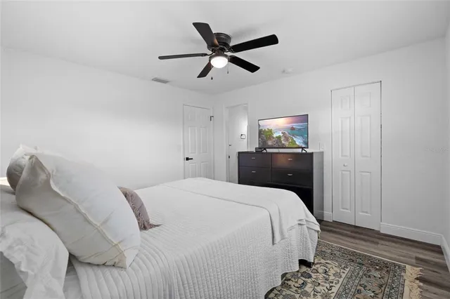 a view of walk in closet with clothes