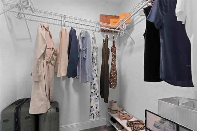 a bathroom with a toilet sink vanity and mirror