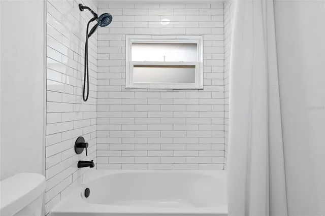 a view of workspace with wooden floor windows