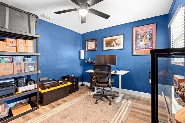 a workspace with furniture hardwood and a window