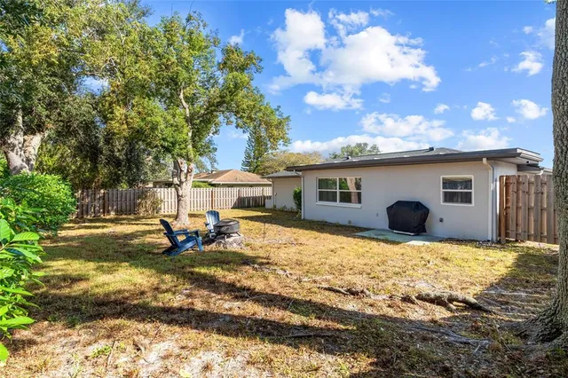 a front view of house with yard having outdoor seating