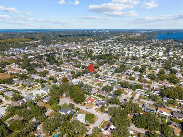 a picture of a room with a white wall and a refrigerator