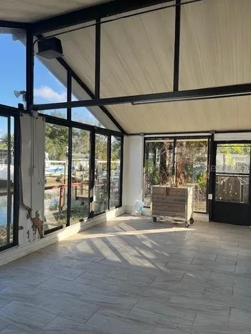 a swimming pool with outdoor seating and patio