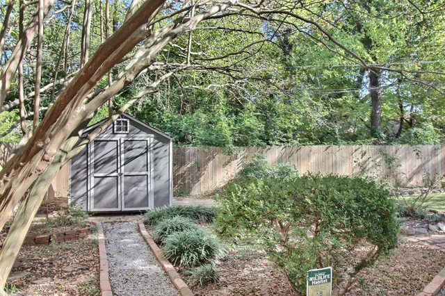a backyard of a house with lots of green space