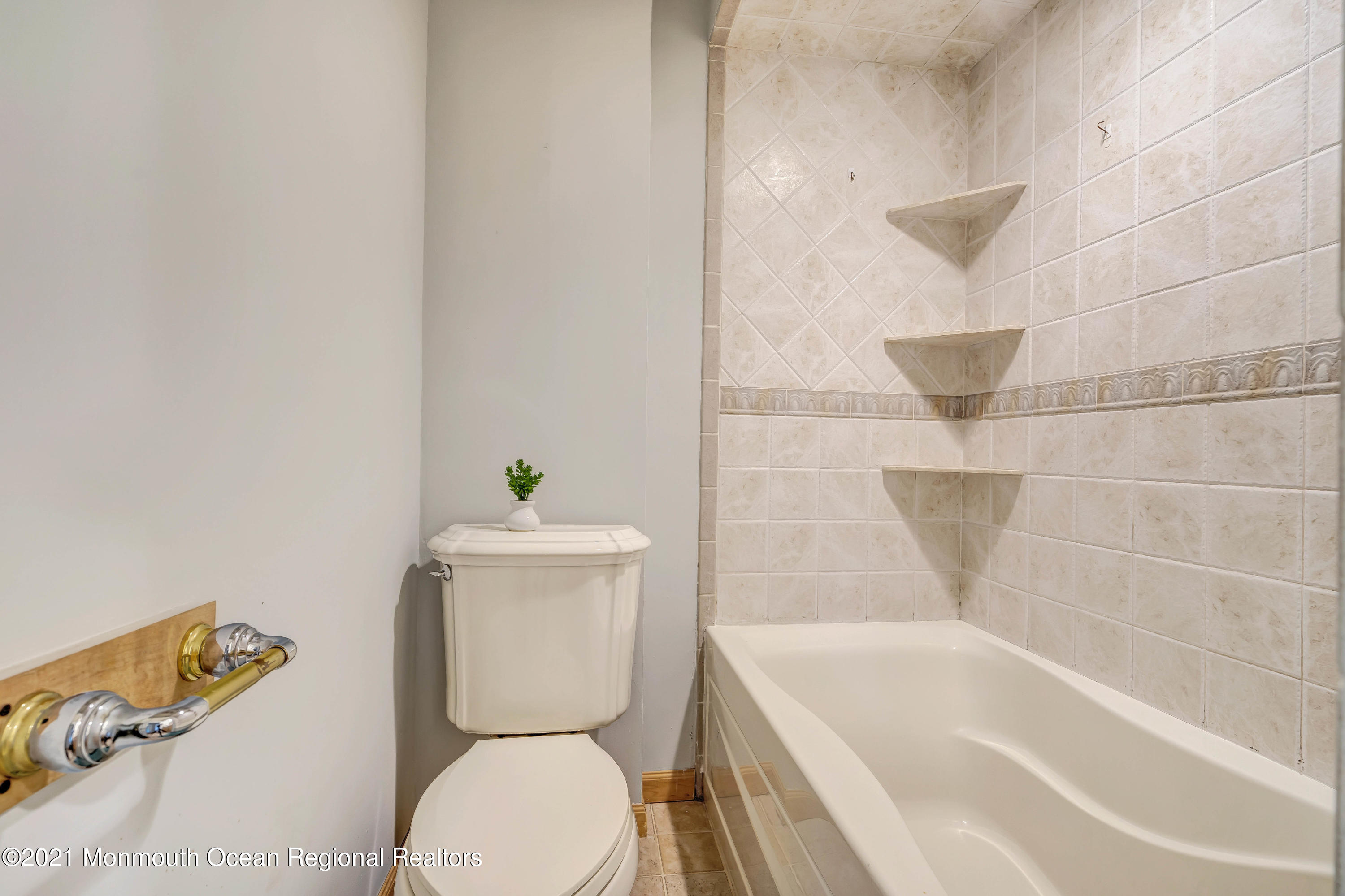 237 Cherry Quay Road Brick, NJ 08723 - Photo 16 of 21 a bathroom with a toilet and a bathtub