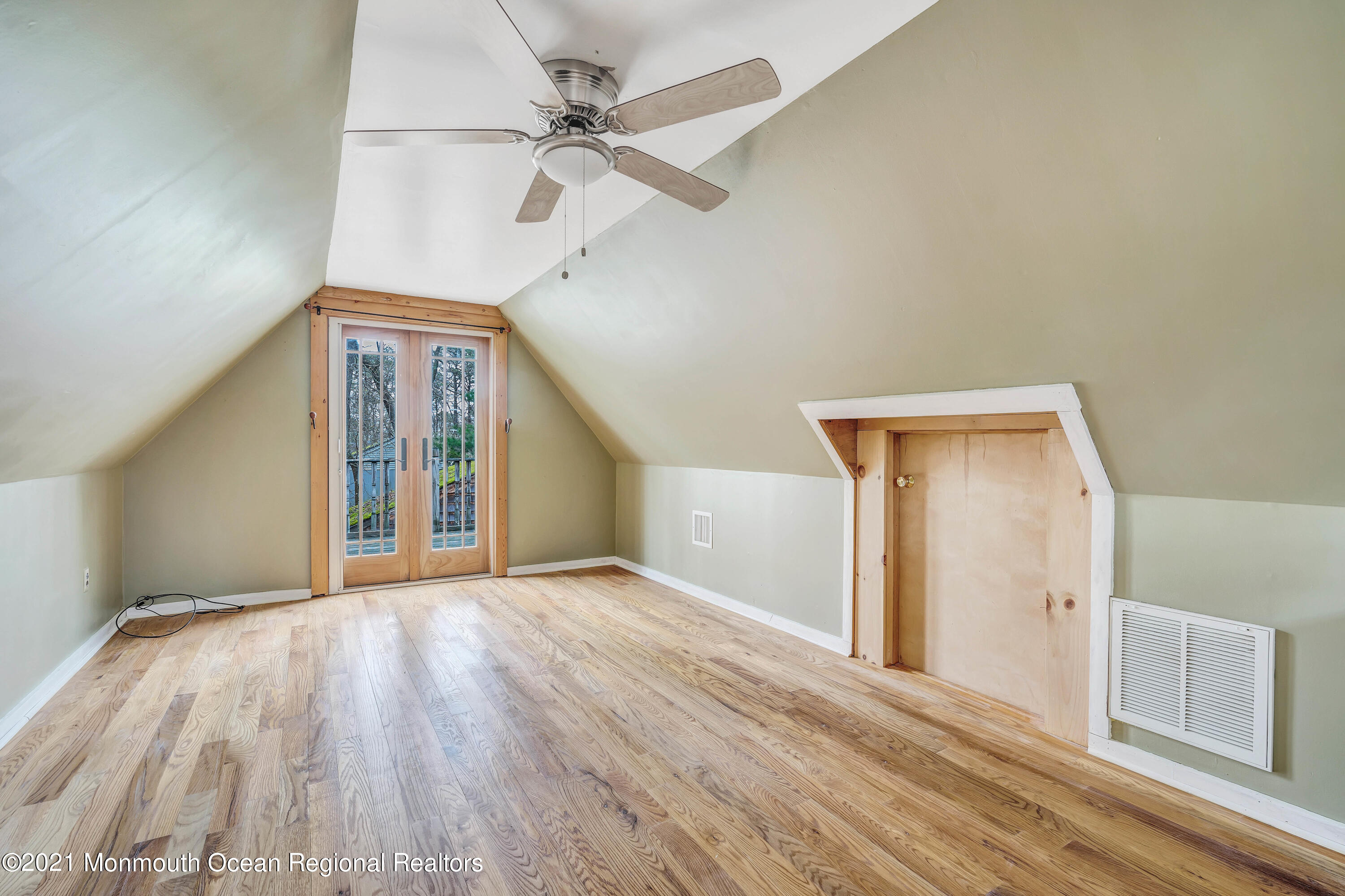 237 Cherry Quay Road Brick, NJ 08723 - Photo 18 of 21 a view of a livingroom with wooden floor and a ceiling fan