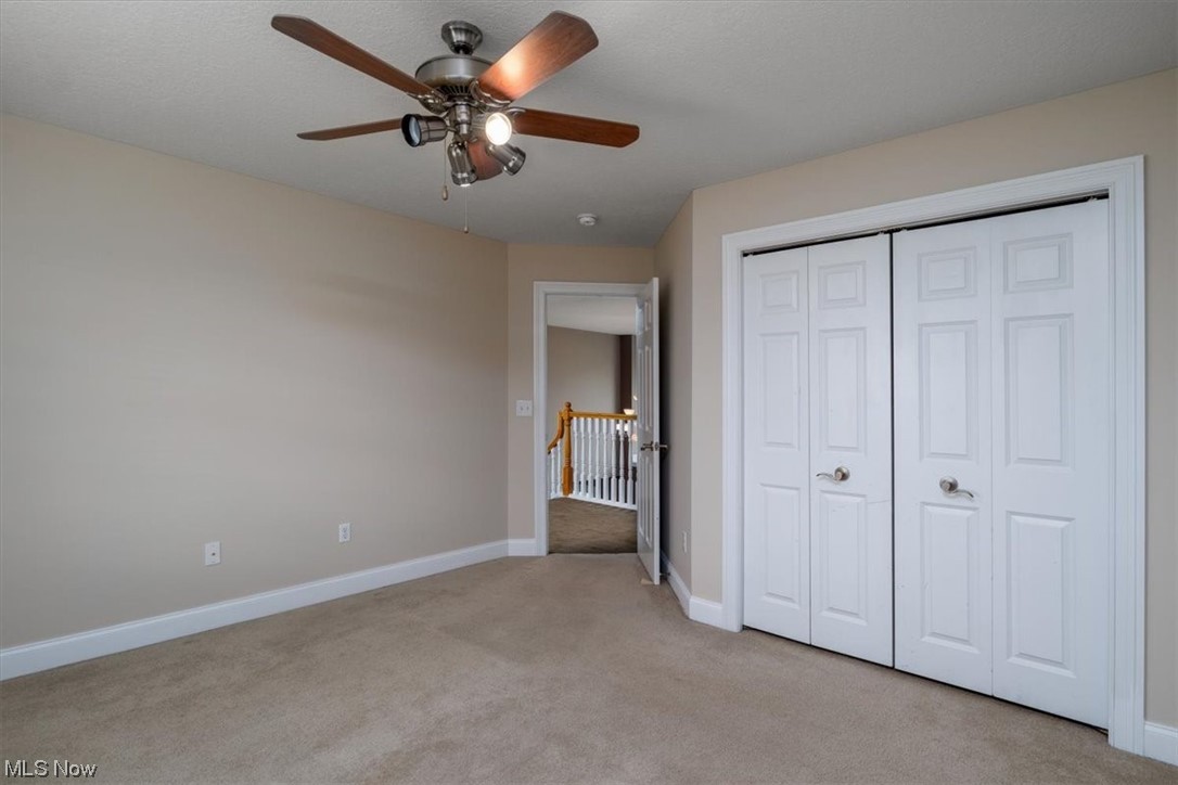 514 Silver Ridge Drive Akron, OH 44321 - Photo 32 of 47 Bedroom on 2nd level with ceiling fan and deep baseboard trim.