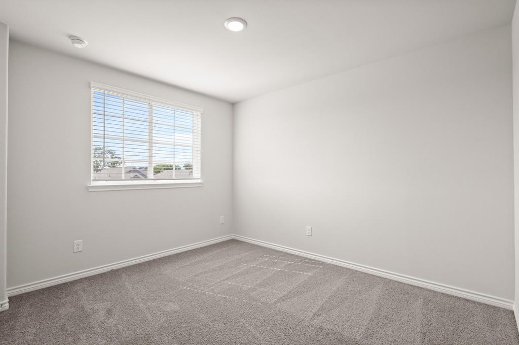 1510 Romans Road Ennis, TX 75119 - Photo 11 of 40 an empty room with a window