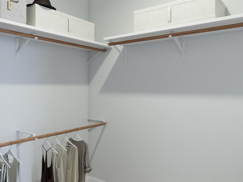 1510 Romans Road Ennis, TX 75119 - Photo 28 of 40 a view of walk in closet with empty racks