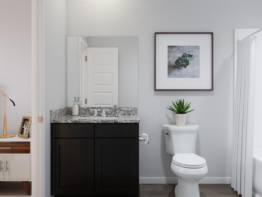1510 Romans Road Ennis, TX 75119 - Photo 30 of 40 a bathroom with a toilet sink and mirror