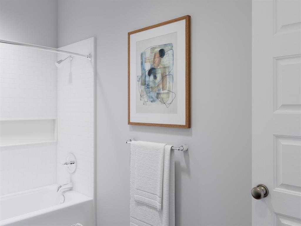 1510 Romans Road Ennis, TX 75119 - Photo 31 of 40 a bathroom with a shower and a bath tub