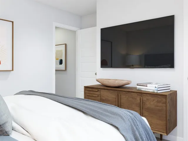 an aerial view of residential houses with outdoor space and parking