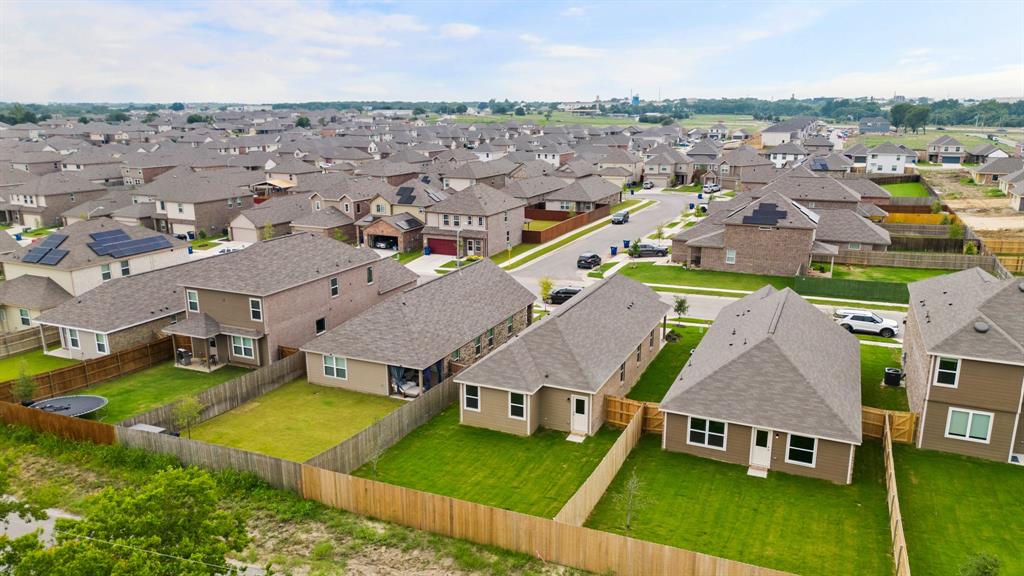 1510 Romans Road Ennis, TX 75119 - Photo 20 of 40 an aerial view of residential houses with outdoor space and parking