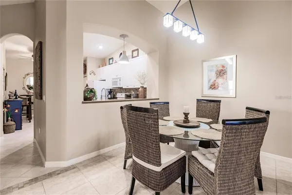 a dining room with furniture and window