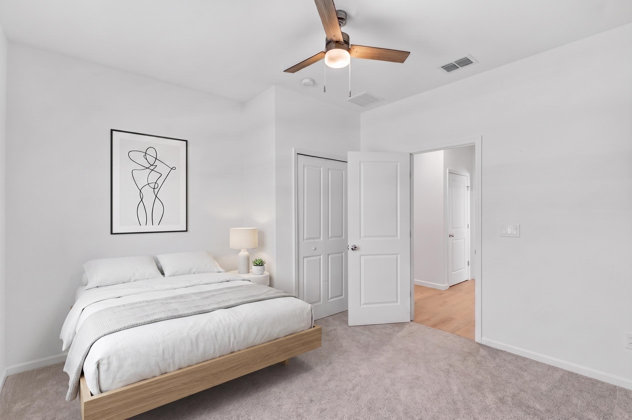 210 White Rabbit Run St. Augustine, FL 32092 - Photo 43 of 85 a bedroom with a bed and a chandelier
