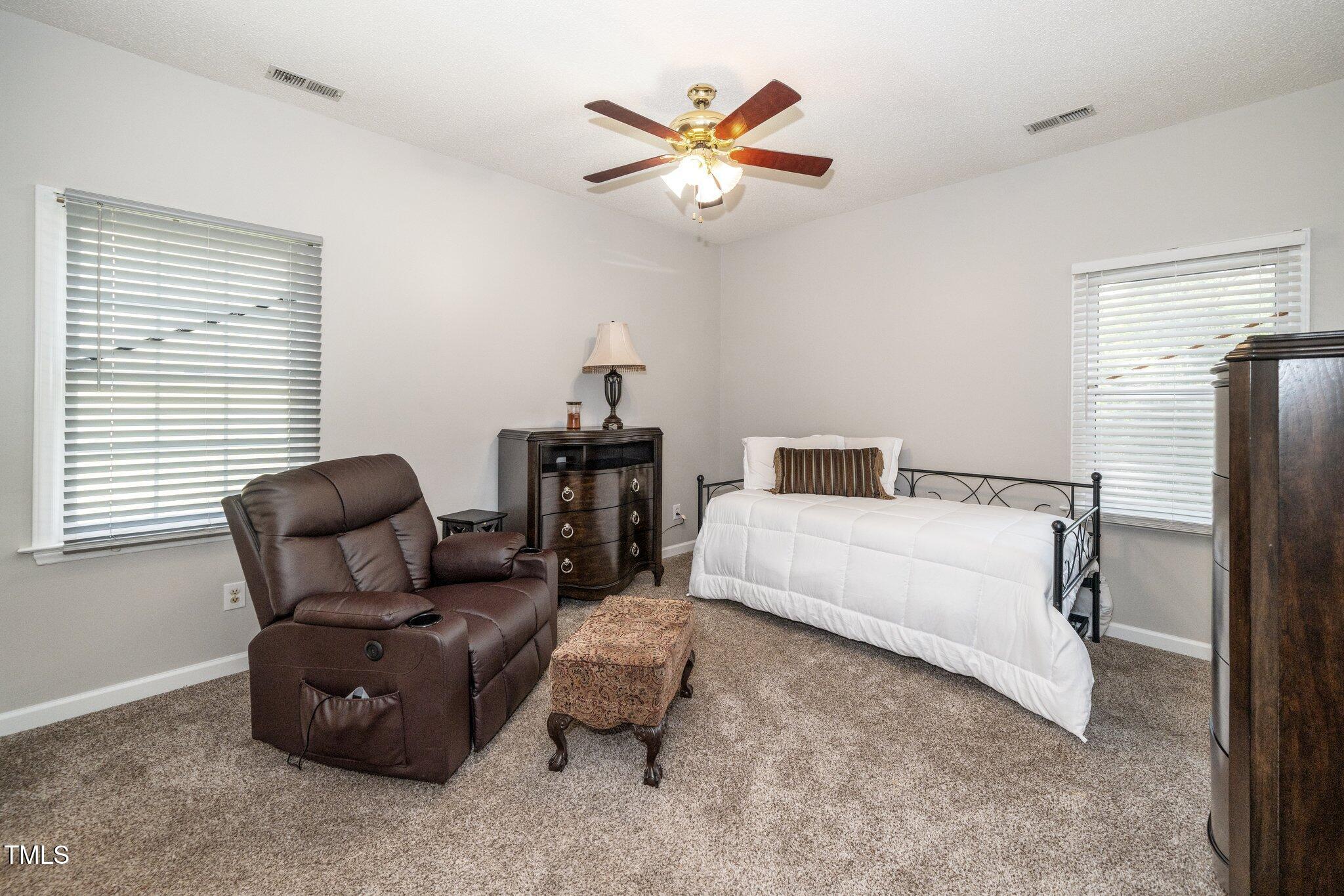6008 River Lake Circle Raleigh, NC 27604 - Photo 12 of 25 a bedroom with a bed and window