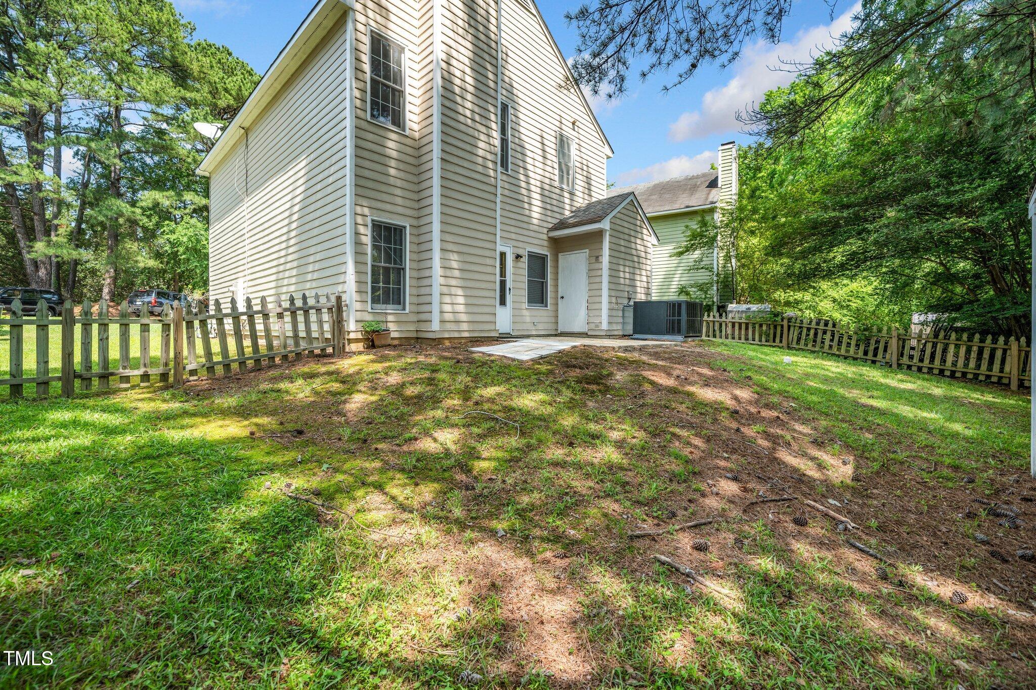 6008 River Lake Circle Raleigh, NC 27604 - Photo 19 of 25 a view of a house with a yard
