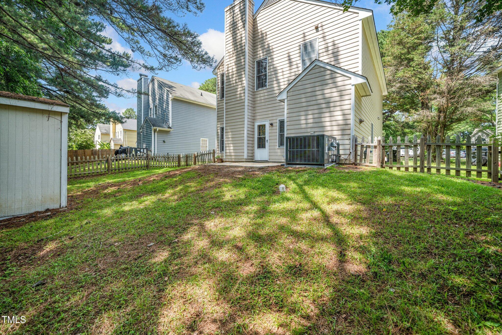 6008 River Lake Circle Raleigh, NC 27604 - Photo 21 of 25 a view of a house with a yard and sitting area