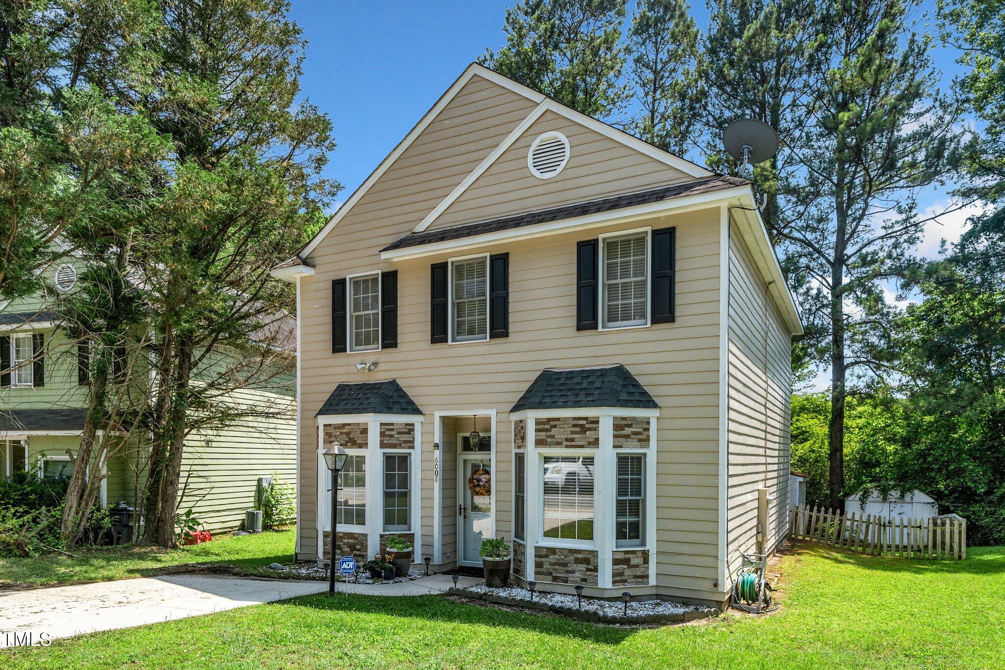 6008 River Lake Circle Raleigh, NC 27604 - Photo 22 of 25 a front view of a house with a yard
