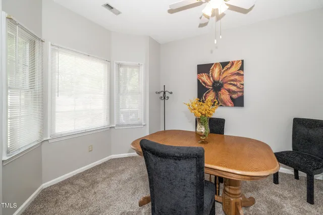 a picture of a bench in front of a wall