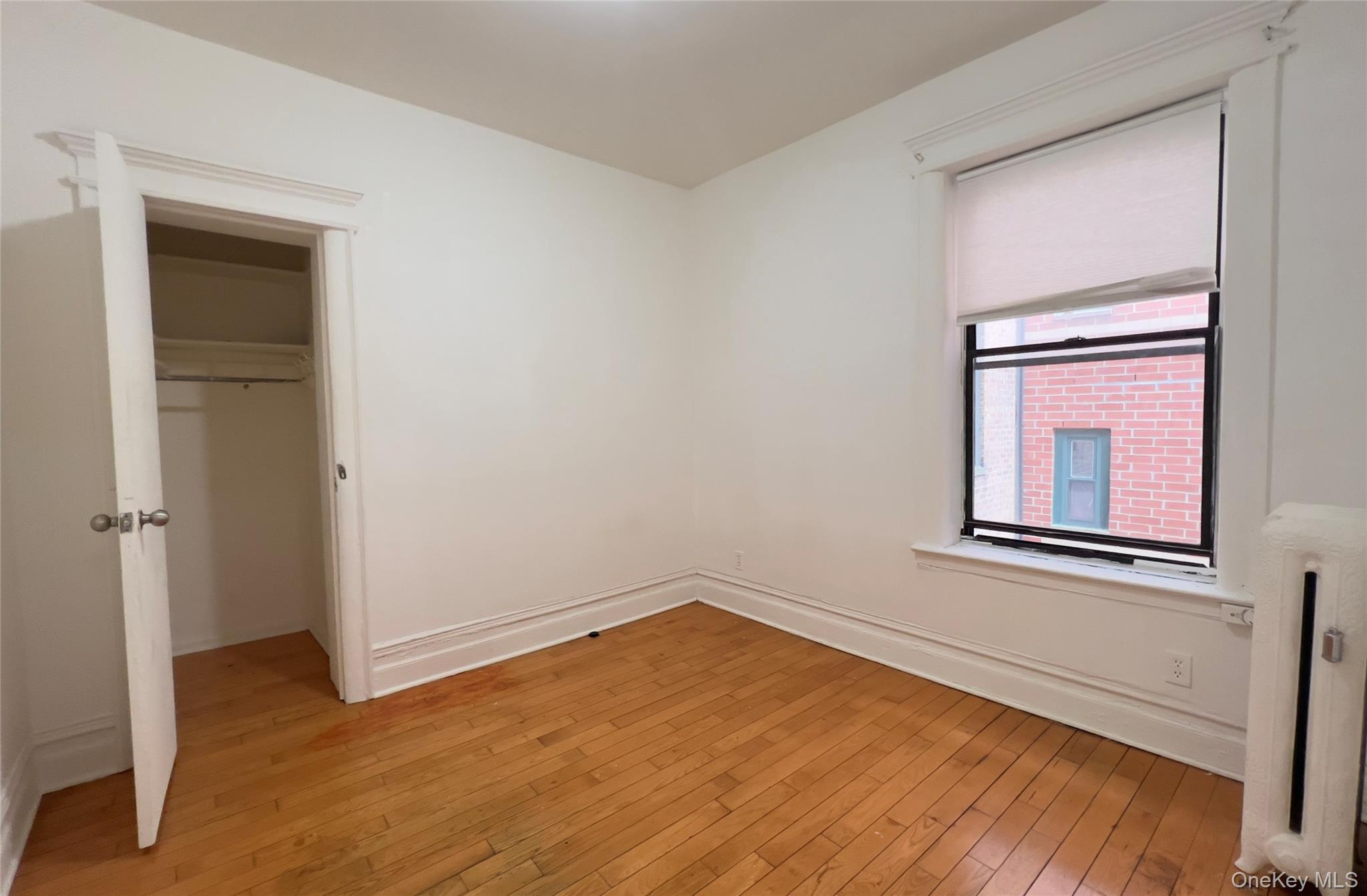 42-14 Union Street, Unit 3D Queens, NY 11355 - Photo 6 of 8 wooden floor in an empty room