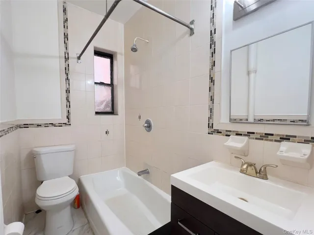 a bathroom with a sink toilet and vanity