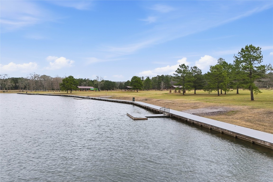 15466 Red Hawk Road Willis, TX 77378 - Photo 13 of 18 a view of a lake with houses