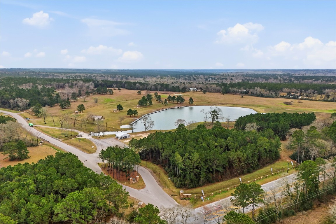 15466 Red Hawk Road Willis, TX 77378 - Photo 14 of 18 an aerial view of residential building and lake view