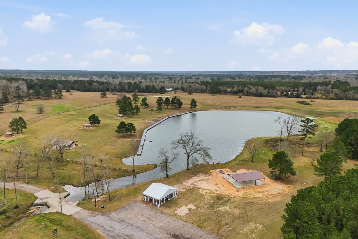 15466 Red Hawk Road Willis, TX 77378 - Photo 17 of 18 a view of a lake with outdoor space