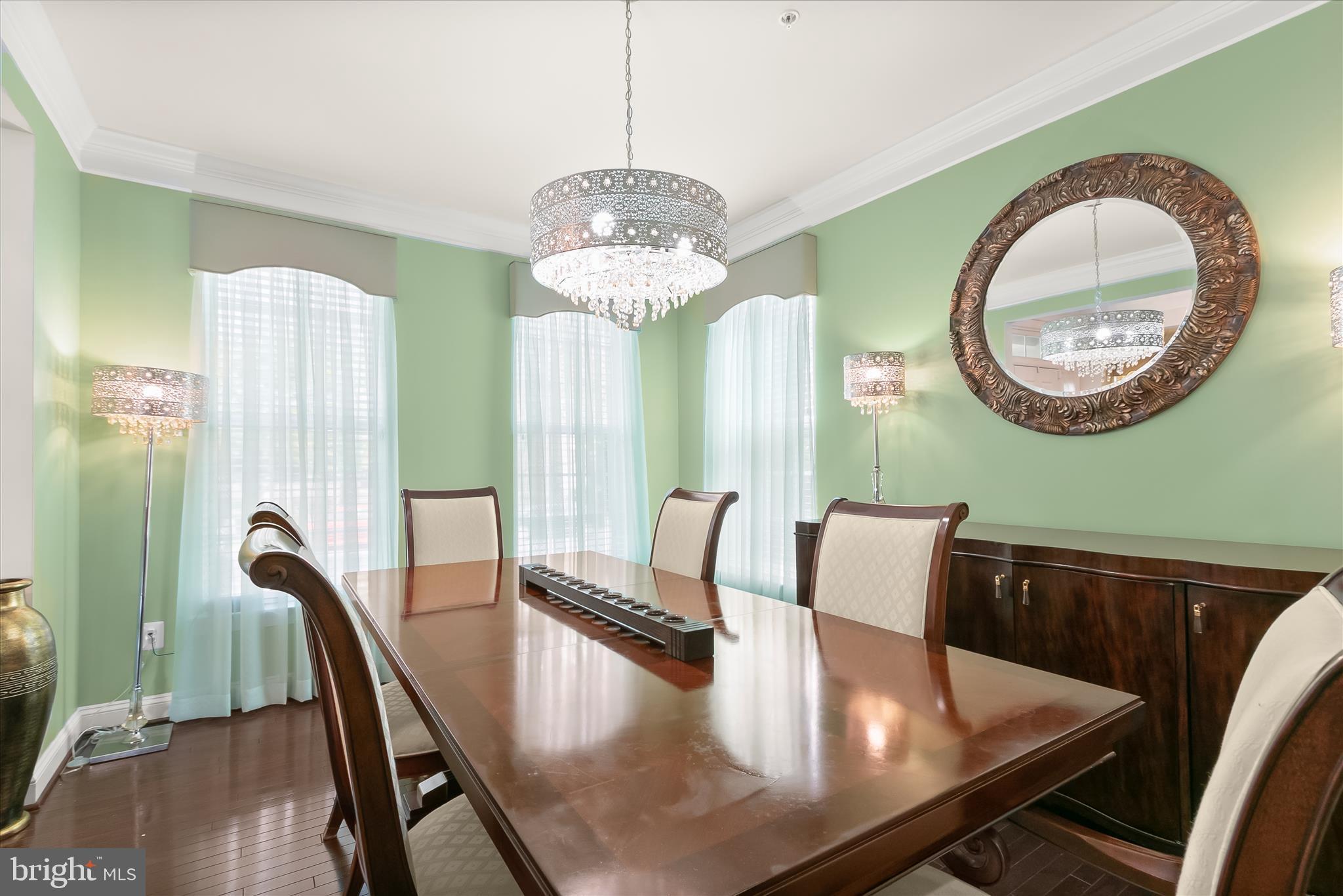 13502 Windy Meadow Lane Silver Spring, MD 20906 - Photo 16 of 74 a view of a dining room with furniture and a chandelier