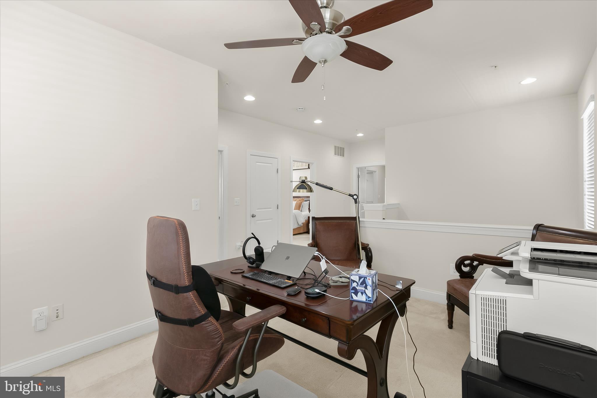 13502 Windy Meadow Lane Silver Spring, MD 20906 - Photo 36 of 74 a view of a workspace with furniture and a potted plant