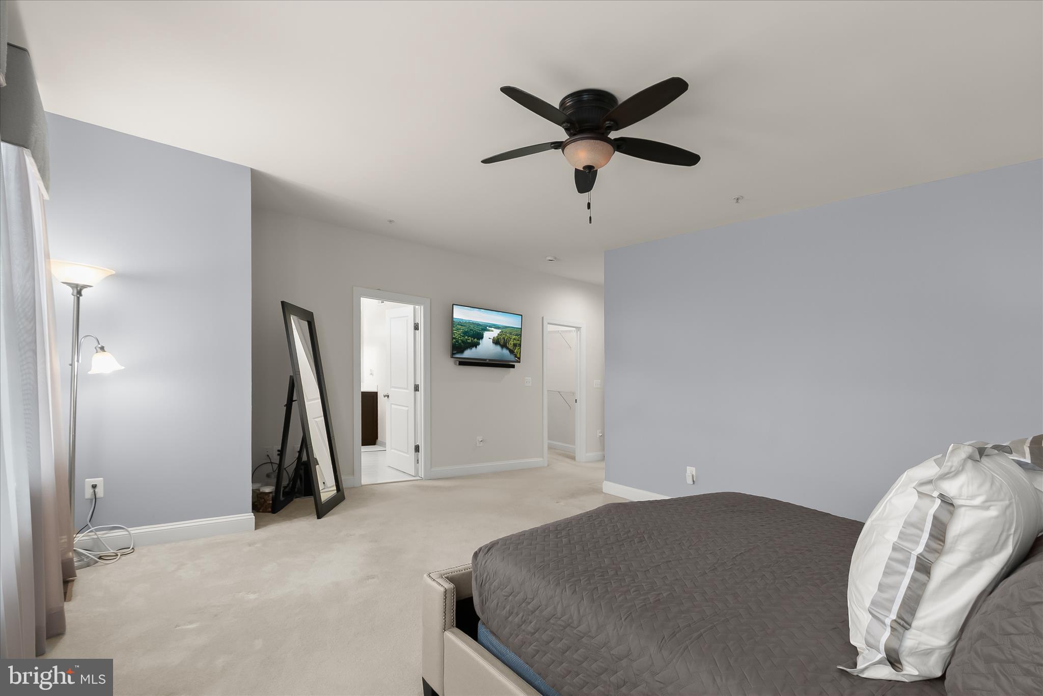 13502 Windy Meadow Lane Silver Spring, MD 20906 - Photo 40 of 74 a bedroom with a bed and a chandelier