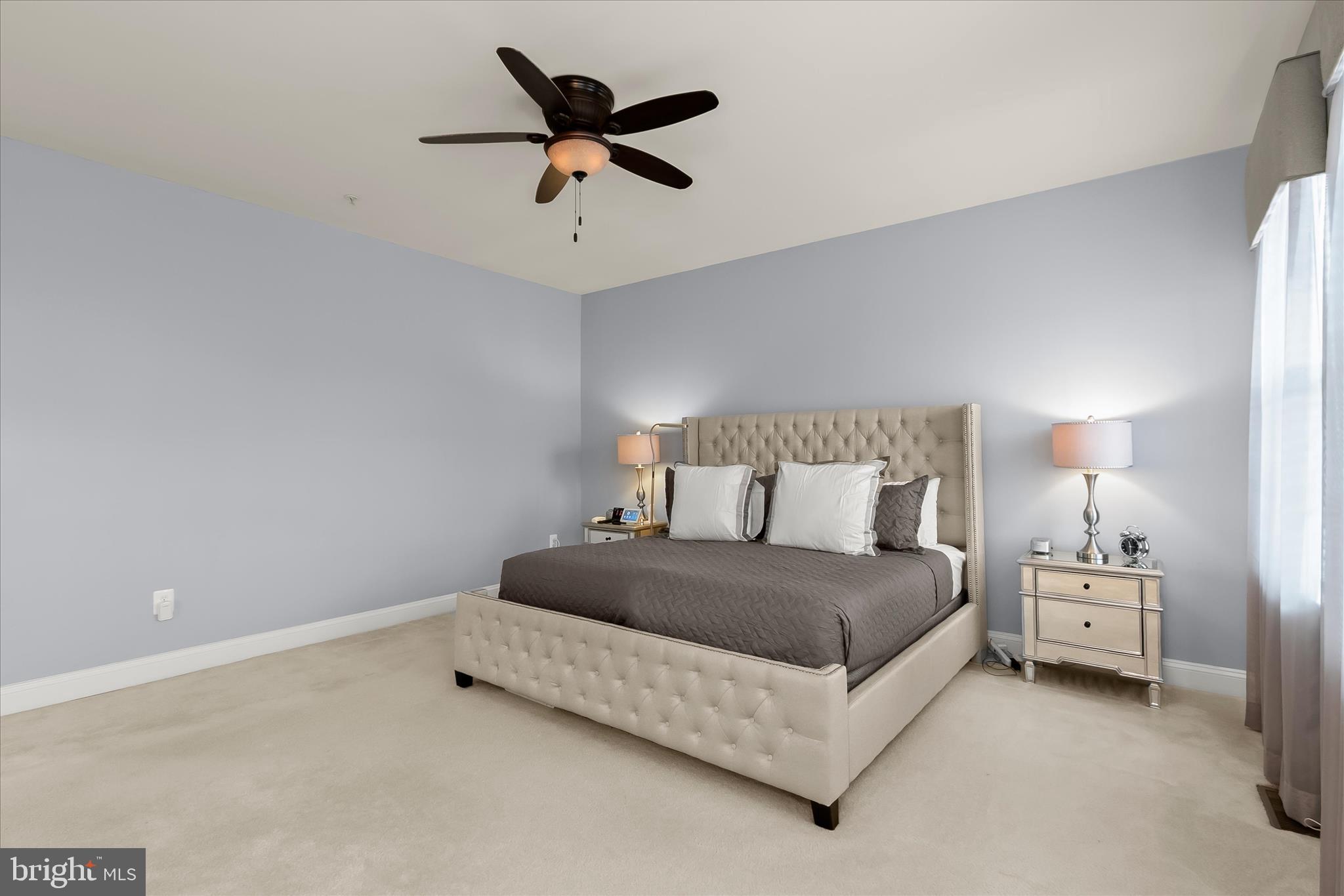 13502 Windy Meadow Lane Silver Spring, MD 20906 - Photo 41 of 74 a bedroom with a bed and a lamp