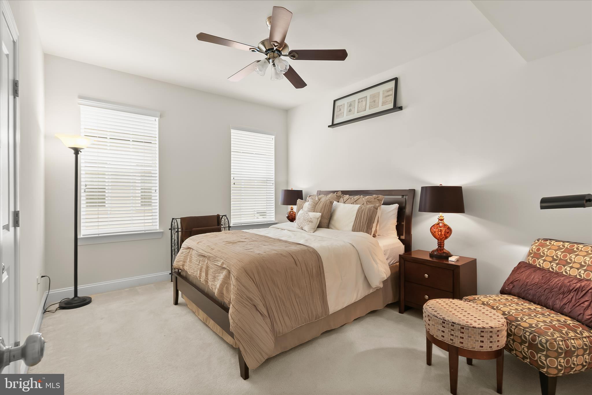 13502 Windy Meadow Lane Silver Spring, MD 20906 - Photo 48 of 74 a spacious bedroom with two beds and a chandelier