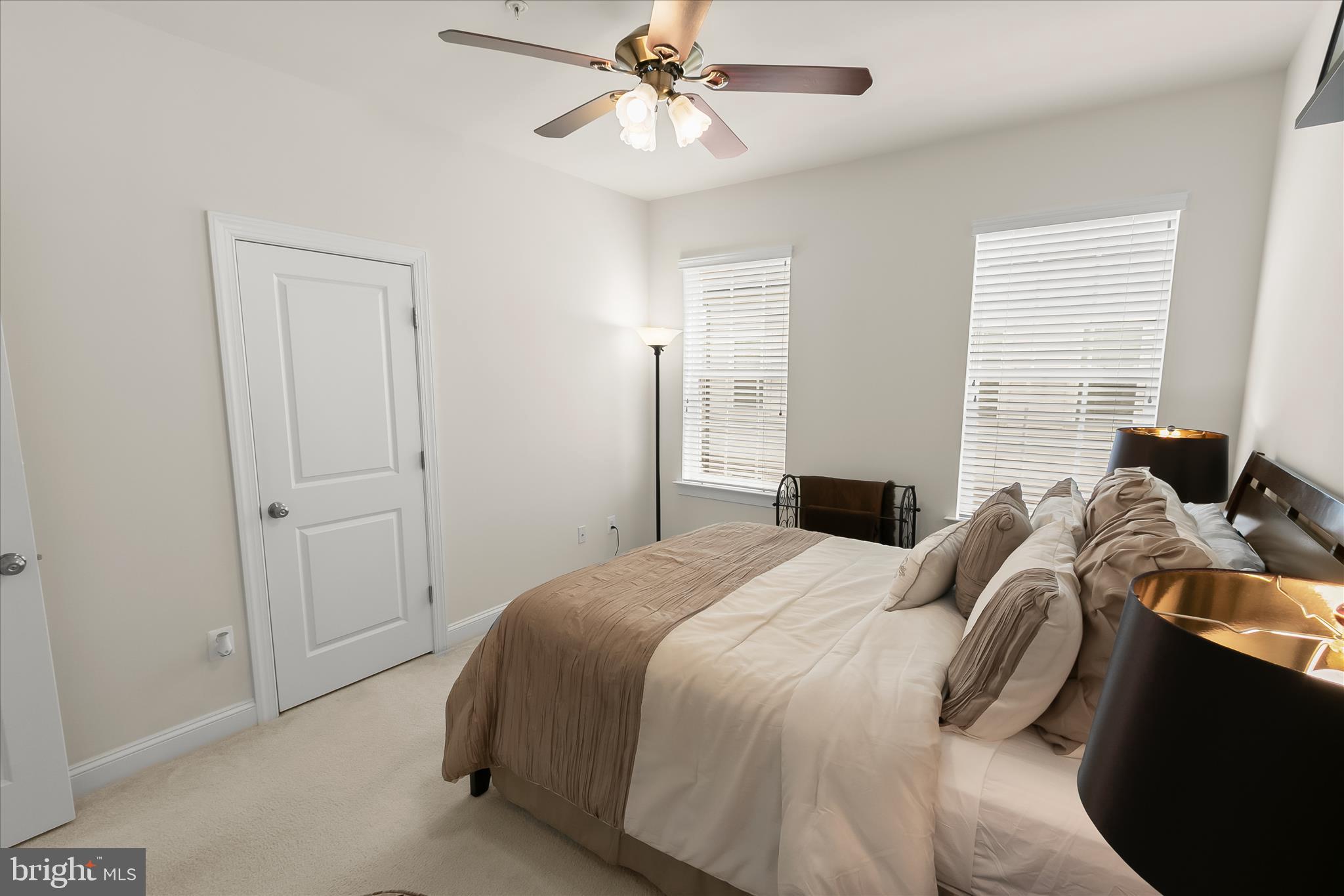 13502 Windy Meadow Lane Silver Spring, MD 20906 - Photo 50 of 74 a bedroom with a bed and a chandelier