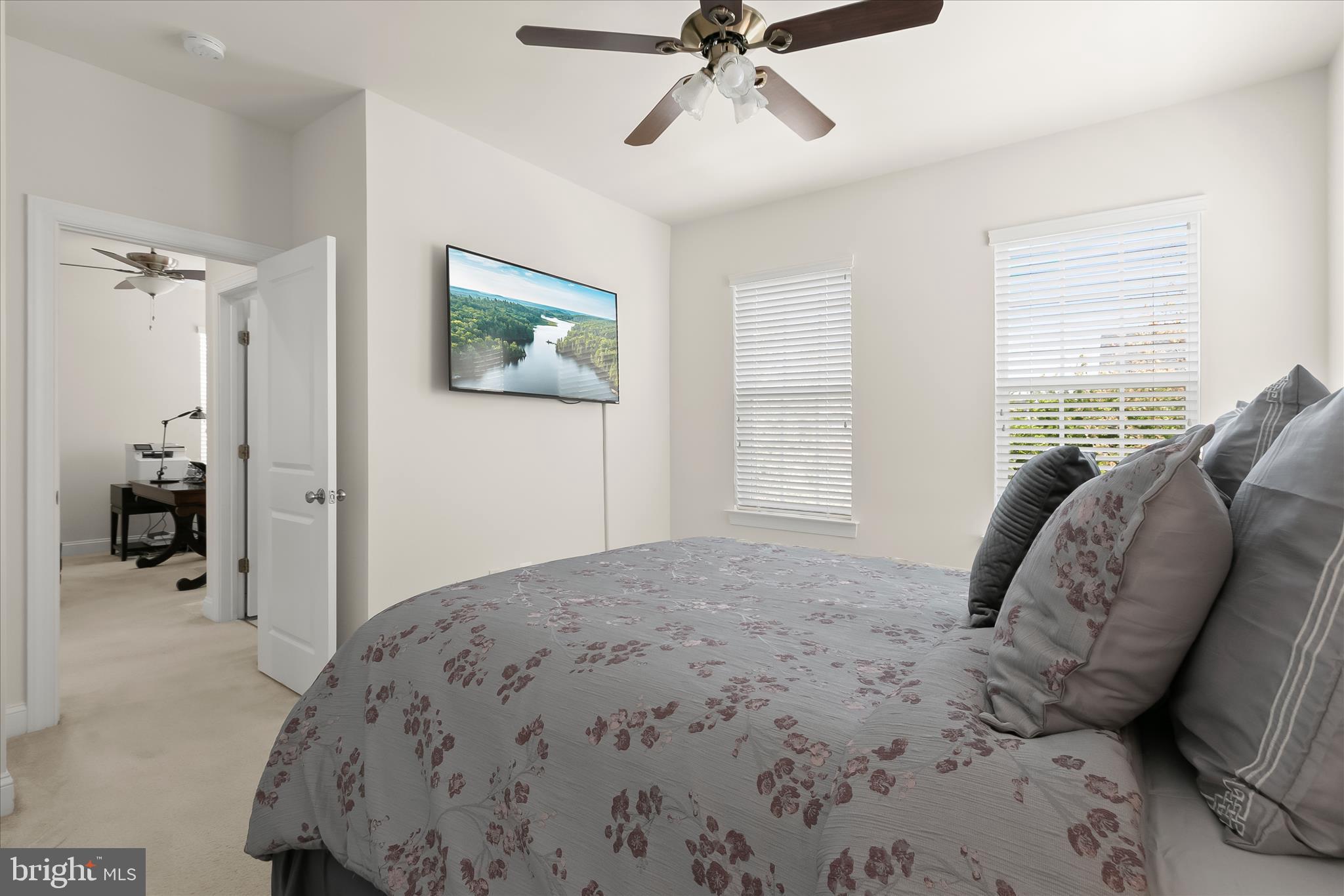 13502 Windy Meadow Lane Silver Spring, MD 20906 - Photo 52 of 74 a bedroom with a bed and a painting