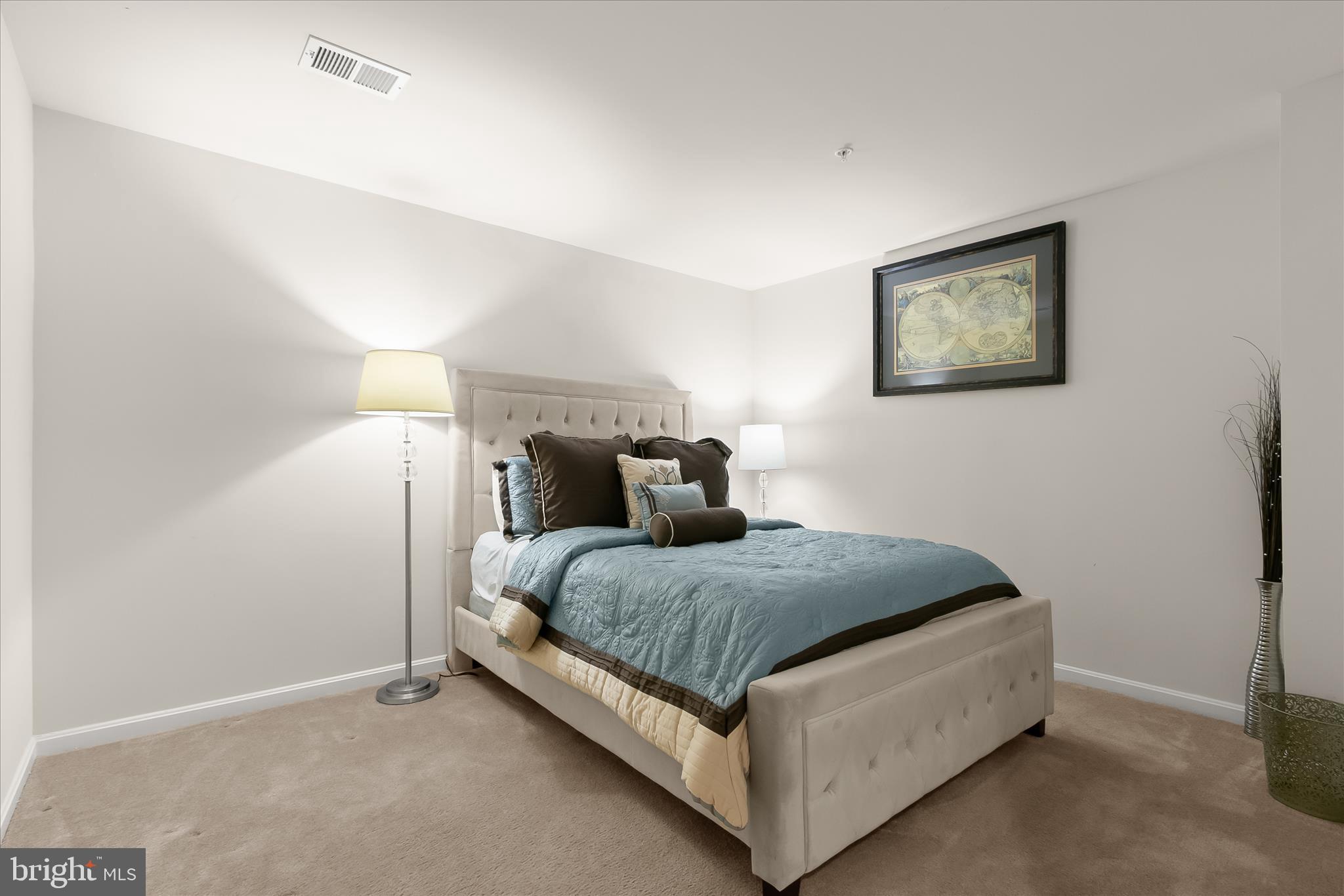 13502 Windy Meadow Lane Silver Spring, MD 20906 - Photo 59 of 74 a bed room with a bed and a night stand